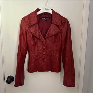 Blanc Noir 100% soft genuine leather, designed to have crinkled appearance.